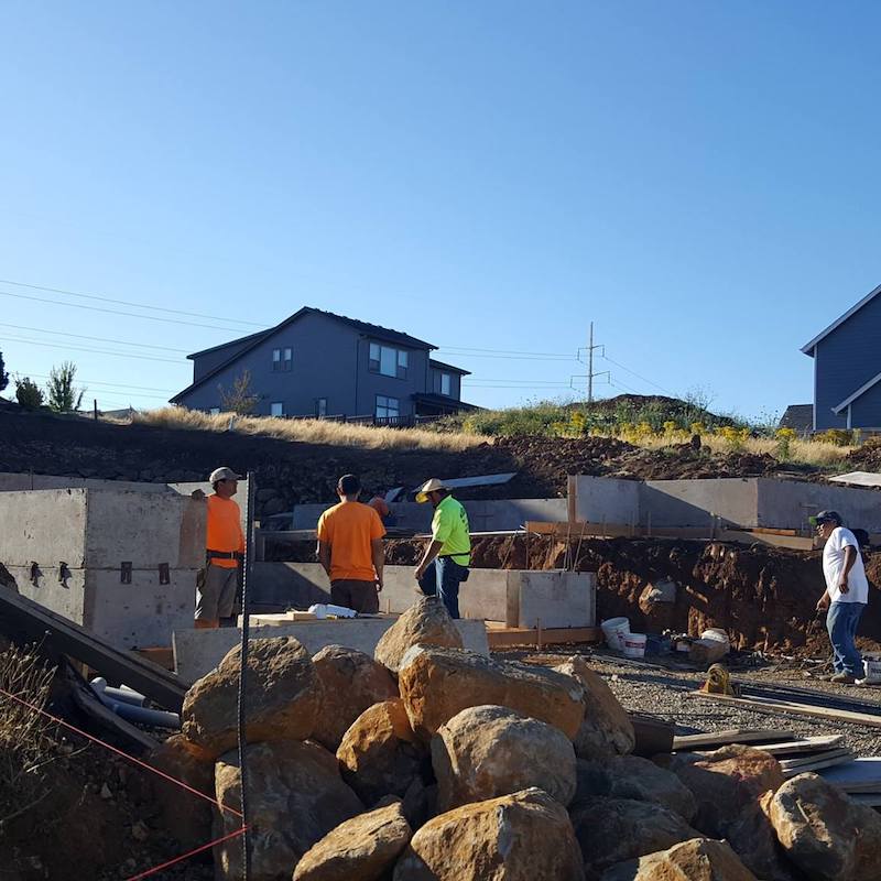 Group of construction workers working on new housing development