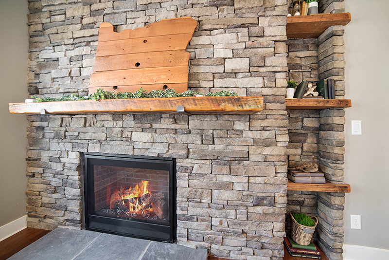 Brick mantle with an Oregon shaped decorative piece